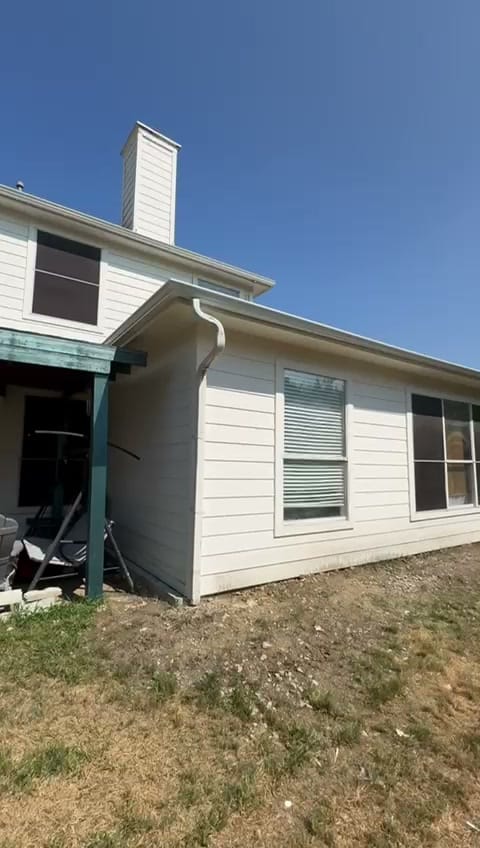Finished one-story room addition with new siding and windows on a Fort Worth home