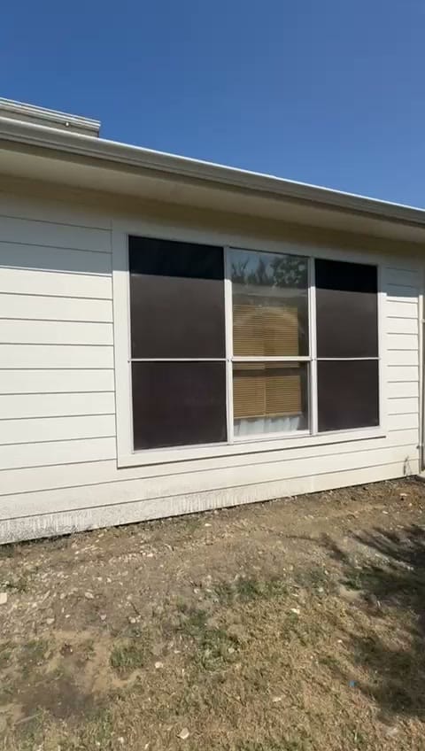 Finished one-story room addition with new siding and windows on a Fort Worth home